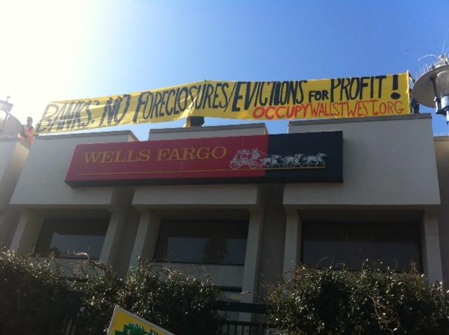 Protesters climb on Wells Fargo roof to protest evictions